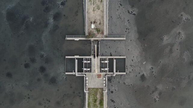 Wastewater treatment plant with aeration basin for sewage sludge processing, environmental engineering, aerial view.