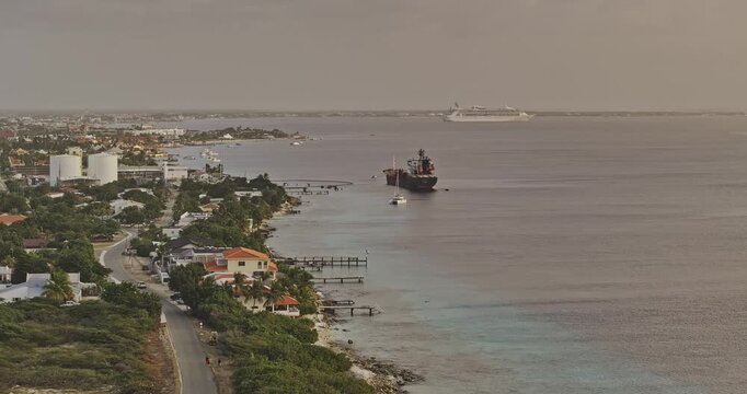 Bonaire Caribbean Netherlands Aerial v39 telephoto flyover along Hato shoreline, revealing coastal homes, Playa, Kralendijk and a ship offshore - Shot with Mavic 3 Pro Cine - Feb 3rd 2024