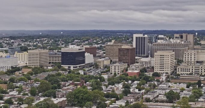 Wilmington Delaware Aerial v4 telephoto flyover from residential neighborhoods toward the downtown skyline beneath overcast clouds - Shot with Mavic 3 Pro Cine - Sept 28th 2023
