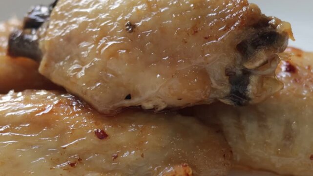 raw chicken leg on a plate