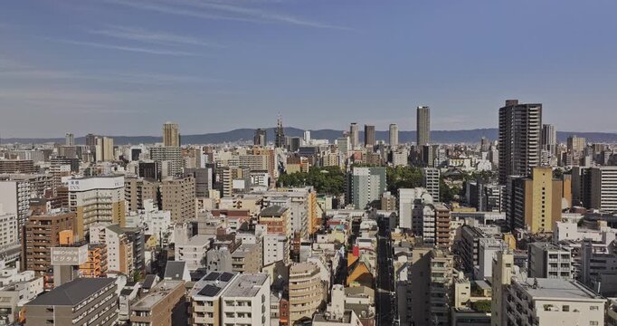 Osaka Japan Aerial v54 low flyover above Nipponbashi and Ikutamacho, revealing Ikukunitama Shrine amid Naniwa and Tennoji cityscape - Shot with Mavic 3 Pro Cine - Oct 9th 2023