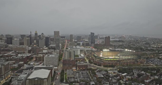Baltimore Maryland Aerial v97 flyover above Barre Circle, revealing Inner Harbor, downtown and Camden Yards ballpark beneath cloudy dusk skies - Shot with Mavic 3 Pro Cine - Sept 28th 2023