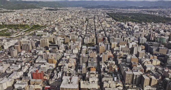 Kyoto Japan Aerial v9 birds-eye flyover revealing Nijo Castle, Nishirokkakucho, Nakagyo and Kamigyo amid the downtown grid and surrounding mountains - Shot with Mavic 3 Pro Cine - Oct 7th 2023