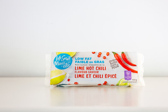 Quebec City, Quebec, Canada, August 3, 2026 - Package of Life Smart lime hot chili low fat rice crackers set on plain cream background