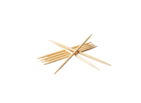 A small pile of sharp wooden toothpicks resting on a surface