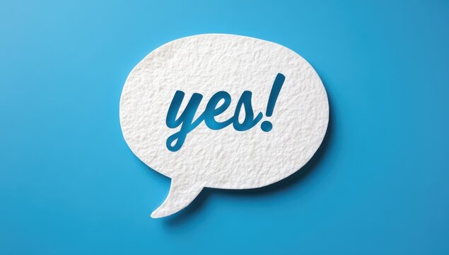 Textured paper speech bubble with blue yes text isolated on blue background communication background affirmation positive agreement decision confirmation approval dialogue isolated