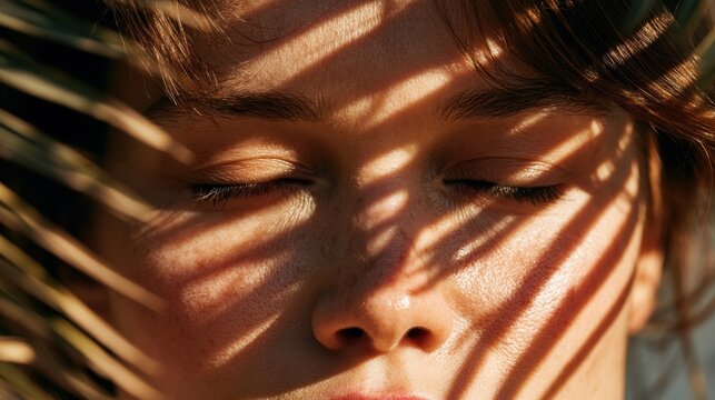 Close up of person with sunlight shadows on face