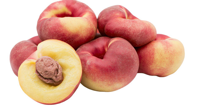 Pile of ripe Saturn peaches one cut in half showing pit, isolated on transparent background