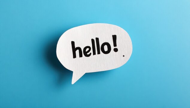 Textured white paper speech bubble containing the word hello in black ink isolated on a bright cyan blue background with greeting communication textured background dialogue minimalist