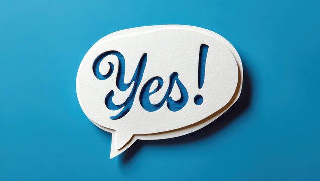 Three-dimensional yes speech bubble icon cutout against a bright blue background representing agreement and approval with communication affirmative agreement approval positive acceptance