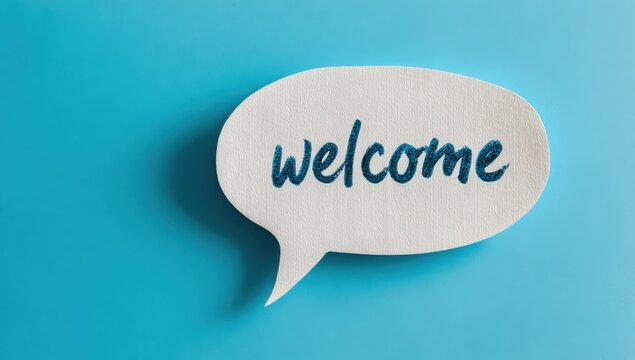 Welcome sign in a paper speech bubble on a blue surface with background greeting communication dialogue conversation minimalist customer hospitality invitation friendly business