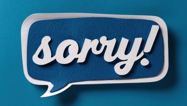 Layered paper speech bubble with sorry written in stylish font on a blue surface communication expression creative conceptual minimalist typography forgiveness dialogue lettering