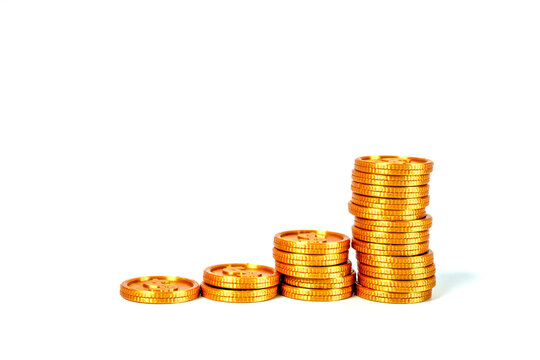 Four stacks of shiny gold coins of increasing height representing financial growth and investment success. Isolated on white background. Professional business concept for savings and profit.