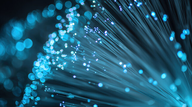 Abstract view of optical fibers glowing with intense blue light. Concept of futuristic innovation, scientific research, and advanced technological development.