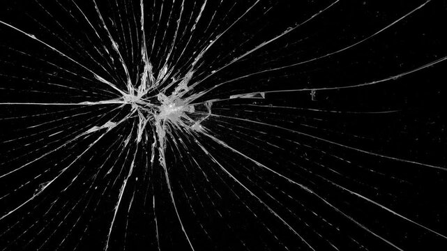 Cracks glass fracture effect texture isolated abstract black background. Realistic Glass impact crack with detailed fractures on a black background. For overlay, simulating broken glass effects. 