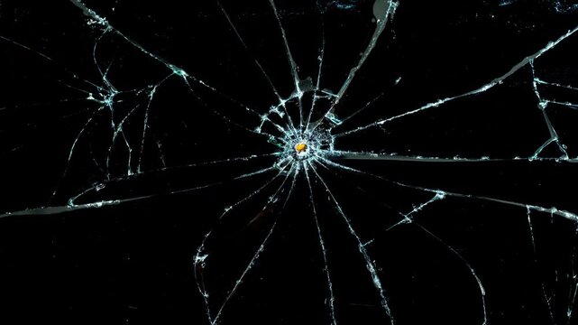 Cracks glass fracture effect texture isolated abstract black background. Realistic Glass impact crack with detailed fractures on a black background. For overlay, simulating broken glass effects. 