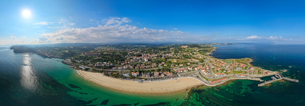 Aerial View of Beachgoers Heading to the Golden Sand Beach and Ocean Shore in the Coastal Village of Comillas, Cantabria, Northern Spain