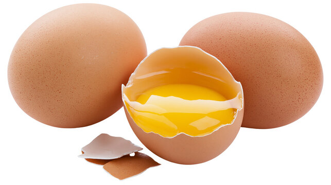 Two whole brown eggs and one cracked egg with bright yellow yolk, isolated on transparent background