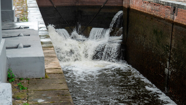 Water flows through a lock system in a canal in a city during a cloudy day The Augustow Canal on the Vistula River and the Neman River in Belarus Grodno Region on July 25, 2026.