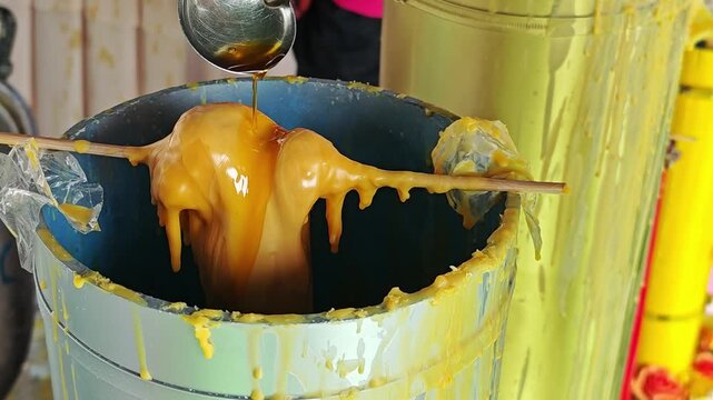 Mold big candles for Buddhist Lent. Candle casting ceremony in Thailand.