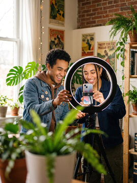 Gen Z friends set up ring light for content creation
