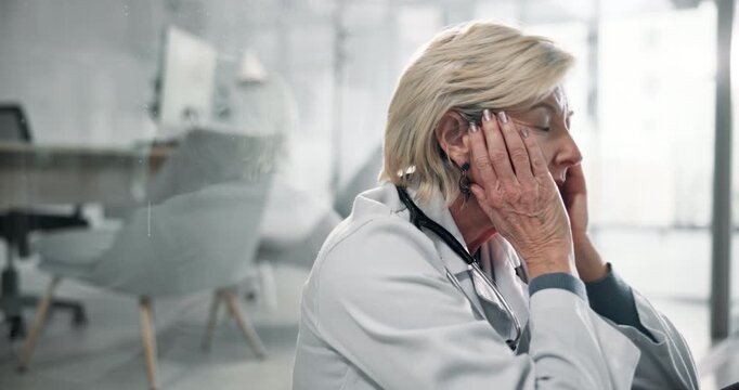Stress, woman and doctor in hospital with fail, crisis or grief of patient for surgery burnout. Upset, bad news and mature surgeon in clinic with worry, disappointment or mistake on medical service.