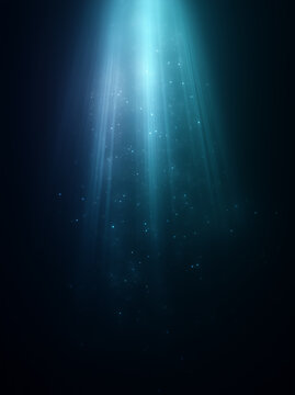 Vertical abstract background with bright blue light ray. Glowing spotlight and floating dust particles on dark black backdrop