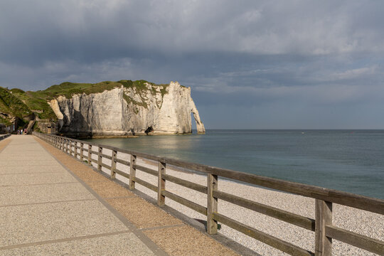 Aval Cliff and natural arch seen from Etretat beach on the Alabaster Coast, Normandy, France