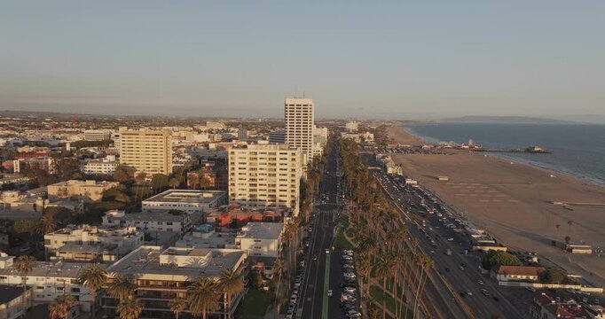Santa Monica California Aerial v15 low flyover along Ocean Avenue, revealing Palisades Park, downtown, PCH, State Beach and pier at sunset - Shot with Mavic 3 Pro Cine - May 25th 2024