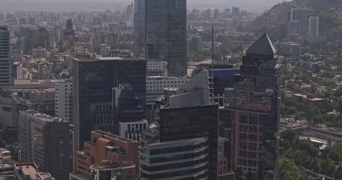 Santiago Chile Aerial v16 telephoto birds-eye flyover above Las Condes and Providencia skyscrapers, revealing the dense downtown skyline - Shot with Mavic 3 Pro Cine - Jan 20th 2025