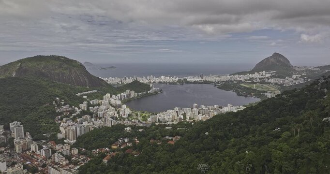 Rio de Janeiro Brazil Aerial v10 flyover past forested Humaita hills, revealing Lagoa Rodrigo de Freitas, Jardim Botanico and Leblon cityscape - Shot with Mavic 3 Pro Cine - Mar 25th 2024