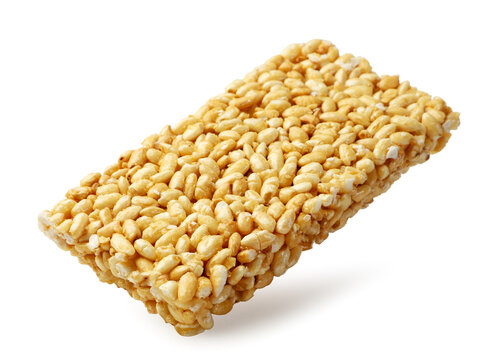 Puffed rice levitating close-up on a white. Isolated