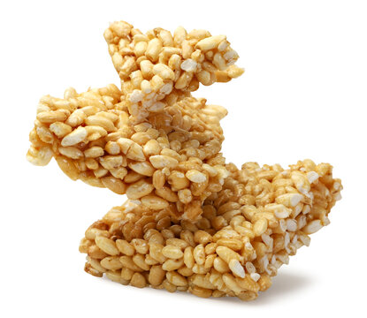 Pieces of puffed rice flying on a white background. Isolated