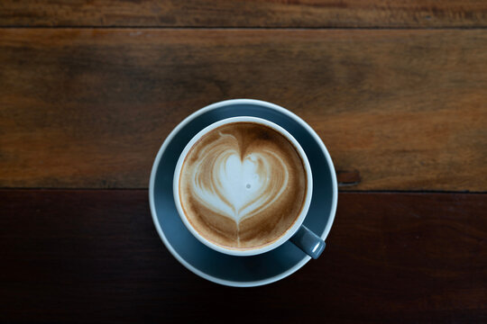 cappuccino on wooden table in top view