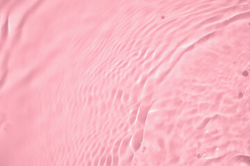 Fototapeta premium Abstract transparent water shadow surface texture natural ripple on pink background