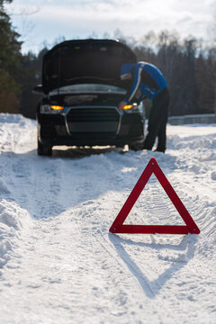 Emergency car breakdown on snowy winter road