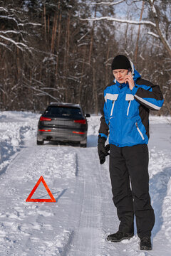Driver call for roadside assistance after winter car breakdown