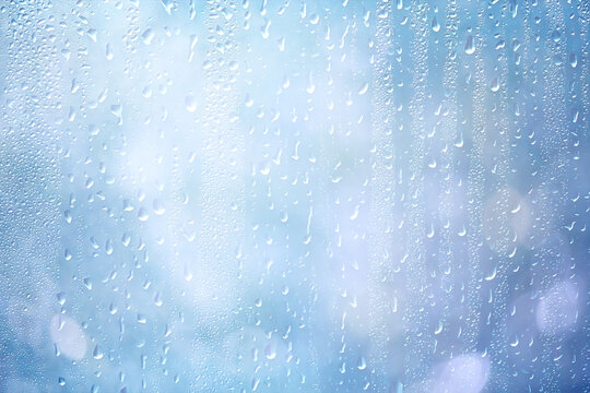 Light green gradient raindrops on glass abstract blurred background gentle summer soft green