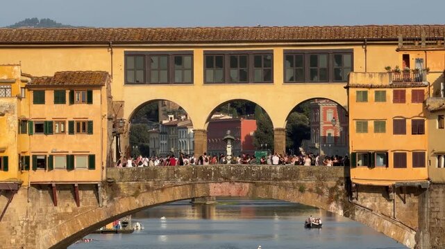 Close-up view of Ponte Vecchio over the Arno River in Florence, Tuscany, Italy. Historic medieval bridge with traditional buildings, iconic Renaissance landmark and popular tourist destination.