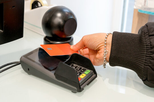 Customer pay with card at pharmacy checkout terminal