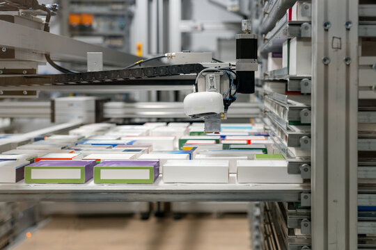 Automated pharmacy machine dispensing medicine packages