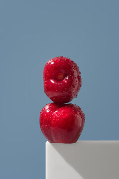 Jerte Picota cherries with water drops on blue background