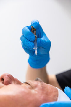 Skincare treatment with disposable pipette in beauty clinic