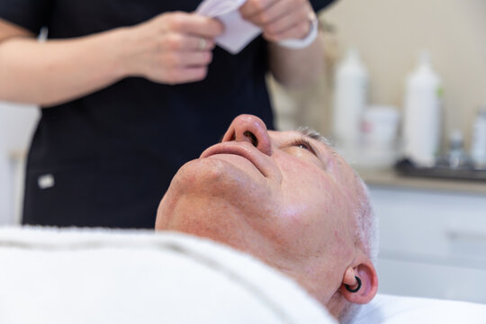 Man after a facial mask treatment at a beauty clinic