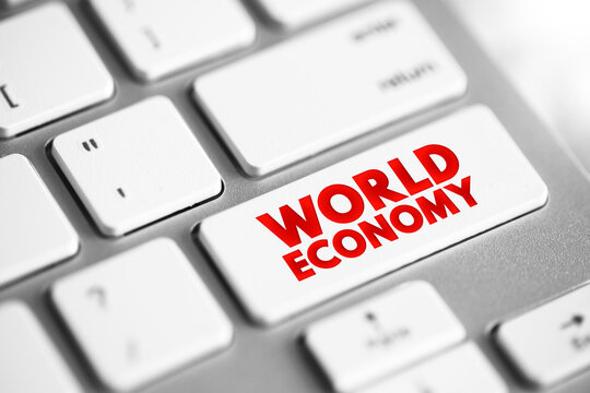 WORLD ECONOMY text is printed on a computer keyboard key. This conceptual macro photography captures modern business trends, technological development, and global transformation concepts clearly.