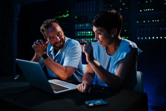 It professionals discussing network security in data center
