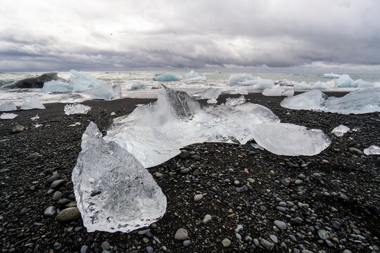 Iceberg fragment on black sand beach in Iceland