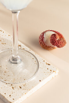 Lychee cocktail ingredients with elegant glass detail