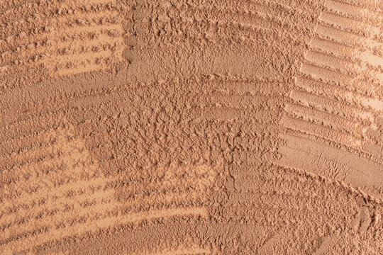 Beige dry powder texture with decorative cosmetic brush strokes