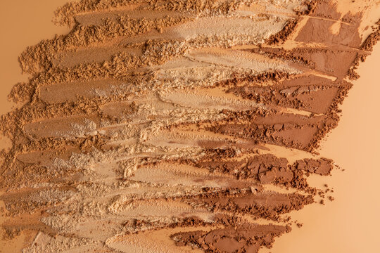 Dry cosmetic powder texture in warm neutral tones